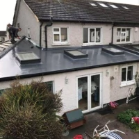 House with repaired flat roof 